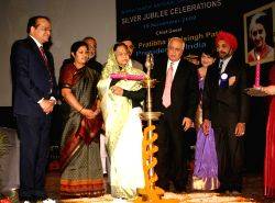 President Pratibha Devisingh Patil launching ''flexi-learning platform'' at the Silver Jubille Celebration of Indira Gandhi National Open University in New Delhi on Thursday also in photo HRD Ministers Kapil Sibal and D. Purandeswari, planning commission member Dr Narendra Jadhav and vice-chancellor V N Rajasekharan Pillai