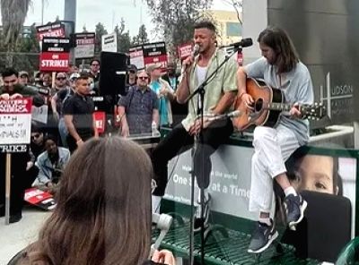 Imagine Dragons supports writers' strike by performing outside Netflix HQ - Vimarsana News